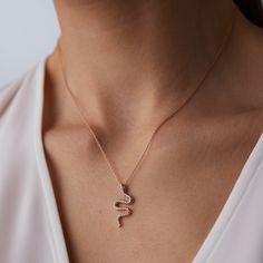 14k Solid Gold Diamond Gemstone 0.25ct Dainty Snake Shaped Necklace Charm Shining Mother Gift Valentina's Gift Friend Gift Christmas Gift ▶ 𝙋𝙍𝙊𝘿𝙐𝘾𝙏 𝙁𝙀𝘼𝙏𝙐𝙍𝙀𝙎 * 14k Solid Gold Necklace * Total Carat: 0.25 ct * Diamond Quality: G Colour VS Clarity * Total Numbers Of: 35 * Necklace Width: 1.10cm (0.43 inches) * Necklace Length: 2.45cm ( 0.96 inches) ❤️ A quality design that will amaze you with its shine that you can choose for your daily or special occasions. Complete the elegance of Snake Shape Diamond Jewelry For Anniversary, Diamond Snake Shape Jewelry For Anniversary, Snake-shaped Diamond Jewelry For Anniversary, Snake-shaped Diamond Accented Jewelry For Anniversary, Snake Shaped Jewelry With Diamond Accents For Anniversary, Fine Jewelry Snake Shape With Diamond Accents, Fine Jewelry With Diamond Accents In Snake Shape, Gift Diamond Accented Pendant Charm Necklace, Gift Diamond Accents Pendant Charm Necklace