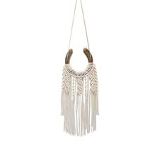 a white macrame hanging from a rope