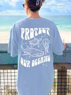 Spread a Message of Environmentalism with this cute and unique Protect Our Oceans Sea Animals Shirt! And you get to have a Sea Turtle Shirt, a Whale Shark Shirt, and a Jellyfish Shirt all in one! This Beachy Comfort Colors® Tshirt is perfect for Summer or Beach Vacation! Super comfy! Size up for a Trendy Oversized Look! SHIPS FREE! SIZING TIPS: Size up 2-3 sizes from your "usual size" to get the "Oversized" Look! (2 sizes up is most common, and 3 sizes up is more dramatic) For a "relaxed fit" or Cheap Beach Tops With Palm Tree Print, Cheap Cartoon Print Tank Top For Summer, Summer Tee Shirt Designs, Underwater Theme Class Shirts Juniors, Ocean Tshirt Design, Casual Ocean Color Crew Neck T-shirt, Ocean Color Crew Neck Cotton Top, Ocean Color Cotton Crew Neck Top, Cotton Crew Neck Top In Ocean Color