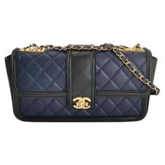 Chanel Elegant CC Flap Bag Navy Black Quilted Medium This Chanel baguette shoulder bag showcases a stunning blend of navy and black hues, complemented by sleek gold hardware. Slightly shorter than the classic flap, this bag boasts an elegant design that is perfect for wearing over the shoulder. Its double chain features both gold and leather elements, which can be adjusted to a single chain for a chic crossbody look. CONDITION: EXCELLENT Light rubbing around the edges. Hardware shows some scratc Navy Chanel Flap Bag, Dior New Look, Convertible Tote Bag, Vintage Chanel Bag, Chanel Suit, Structured Shoulder, Chanel Brand, Interior Clean, Chanel Wallet