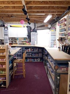 the inside of a craft shop with lots of shelves and drawers on the wall,