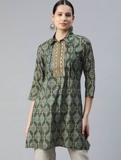 * Modal Shirt Collar Printed Ethnic Tunic Printed Kurti / Embroidered Short Kurti / Indian Tunic / Summer-Spring Evening Dress / Cotton Tunic Tops * Green and gold-toned printed tunic,has a shirt collar, three-quarter sleeves, embroidered detail *Fabric:- Modal  * Package Contains:-   Only One Kurti *Wash Care:- Hand Wash AVAILABLE IN 6 SIZES THEY ARE IN FOLLOWING MEASUREMENTS IN INCHES:- XS:- Bust-34/Waist-26/Length-36 S:- Bust-36/Waist-28/Length-36 M:- Bust-38/Waist-30/Length-36 L:- Bust-40/Wa Green Printed Tunic Kurta, Festive Printed Tunic Blouse, Green Traditional Tunic Top, Traditional Green Tunic Top, Bohemian Straight Kurta Blouse For Eid, Green Long Sleeve Tunic With Printed Motifs, Festive Straight Kurta Top With Bandhani Print, Festive Green Cotton Tunic, Traditional Long Sleeve Tunic With Ikat Print