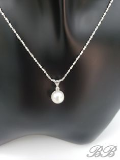 A timeless classic! This listing is for a 925 unplated sterling silver natural white freshwater cultured pearl necklace with a moissanite accent stone. Made to order. Please allow 3 weeks for the production of your necklace. Included in this purchase is a 1mm sterling silver chain in the style and length of your choosing. This necklace can be customized with any pearl color & size, or accent gemstone combination. Just message me for a quote =) Stone Dimensions 8MM Pearl, 2mm Round Moissanite *Li White Pearl Necklace With Gemstone For Formal Occasions, Elegant Akoya Pearl Necklace With Gemstone, Classic Sterling Silver Pearl Drop Jewelry, Diamond White Pearl Drop Pendant Necklace, White Akoya Pearl Necklace With Gemstone, Fine Jewelry Pearl Drop Necklace In Pearl White, Diamond White Pearl Drop Necklace, Silver Akoya Pearl Chain Necklace, Pearl White Pearl Drop Fine Jewelry Necklace