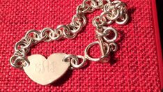 Vintage authentic Gorham Silverplate heart charm chain bracelet monogrammed EAR, silverplate heart charm bracelet 5"-8" adjustable lock, on sale. 1970's great quality. Weight: 0.8 oz Measures: 8"  Heart measures: 1" The monogram script letters are: E A R  The "A" is more prominent. From a distant the other two letters look like they are just script scroll design with just the letter "A" in the center. Email any questions prior to purchase. No returns or refunds or exchanges. Silver Heart-shaped Name Bracelet For Personalized Gift, Silver Personalized Heart Bracelet, Silver Heart Name Bracelet For Personalized Gift, Personalized Sterling Silver Heart Bracelet, Personalized Silver Name Bracelet With Heart Shape, Personalized Heart Pendant Bracelet In Silver, Personalized Silver Heart Pendant Bracelet, Personalized Adjustable Classic Heart Bracelet, Classic Adjustable Personalized Heart Bracelet