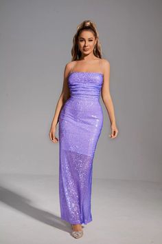 The glittering Gabriela Purple Sequin Maxi Dress will definitely make you the focus! With a fine workmanship sequined fabric, this maxi dress is well wrapped in the whole body, showing a charming figure. Halter neck and backless design add sexy charm. Whether it is a banquet or an important party, this item will be the best choice in your wardrobe!  Dress Length: Approx 131cm Materials: Sequin Gentle Dry Clean Only  The model is 5 ft 7 and wears size S  Color may vary due to lighting on images. Glittery Purple Dress, Floor-length Maxi Dress With Contrast Sequin For Evening, Sleeveless Glitter Gown For Evening, Glitter Maxi Prom Dress, Glitter Maxi Length Prom Dress, Glitter Floor-length Prom Dress, Glitter Floor-length Maxi Dress For Prom, Glitter Fitted Maxi Evening Dress, Fitted Glitter Maxi Evening Dress