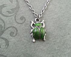 Scarab Necklace VERY SMALL Scarab Jewelry Egyptian Necklace Egyptian Jewelry Beetle Necklace Silver Green Metal Necklaces With Charms, Green Metal Necklace With Charms, Adjustable Green Metal Necklaces, Green Nickel-free Pendant Charm Necklace, Green Metal Necklace With Adjustable Chain, Green Metal Pendant Charm Necklaces, Adjustable Green Charm Necklace, Green Charm Necklace With Adjustable Chain, Eat Jewelry