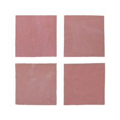 four square pieces of pink colored tile on a white background