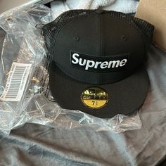 Box Logo Supreme Mesh Back New Era Fitted 7 3/4 Size Cap Brand New Authentic Comes With Original Packaging Color: Black Black Visor Hat With Logo Patch, Black Hat With Logo Patch And Flat Bill, Black Trucker Hat With Logo Patch Visor, Black Trucker Hat For Sports With Short Brim, Black Trucker Hat With Short Brim For Sports, Urban Black Visor Fitted Hat, Black Urban Flat Cap, Urban Black Flat Cap, Black Urban Visor Hat