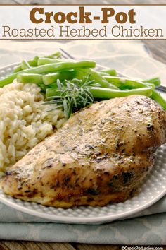 a white plate topped with chicken, rice and green beans