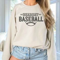 Gear up for success on and off the field with our Custom Baseball Team Sweatshirts, designed to unite your squad in style. Whether you're prepping for game day or celebrating a hard-fought victory, these sweatshirts are the ultimate symbol of team pride. Crafted from premium, ultra-soft fabric, our sweatshirts offer unbeatable comfort and durability, ensuring you stay warm and cozy during those chilly practices and post-game celebrations. But what truly sets them apart is their customizable design – you have the freedom to add your team's logo, name, or any other personalized details that represent your squad's identity. From Little League dreamers to seasoned veterans, our Custom Baseball Team Sweatshirts are perfect for players of all ages and skill levels. Whether you're huddling up in Baseball Team Hoodie Ideas, Team Sweatshirts, Sport Clothes, Logo Name, Graphic Apparel, Baseball Team, Crew Sweatshirts, The Field, Game Day