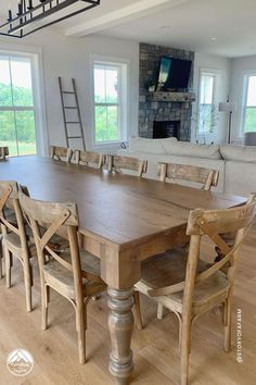 a large wooden table with chairs around it