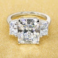 14K Gold 5ct Radiant-cut Moissanite Three-Stone Engagement Ring | Earthena Jewelry Bold Engagement Rings, Radiant Cut Diamond Ring, Radiant Ring, Prong Ring, Future Engagement Rings, Bridal Engagement Rings, Shine Bright Like A Diamond, Three Stone Engagement, Stone Engagement Rings