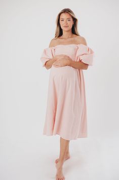 The Hamilton is everything you're looking for in a midi dress - charming, sophisticated, and absolutely flattering. It features premium quality details, like a sweetheart neckline and gorgeous balloon sleeves that can be worn on or off the shoulder. It's an unforgettable choice for every body type, and extra-comfy for expecting mamas! The best part? You can wear this beauty long after your sweet baby arrives! Available in multiple colorways. FIT: Runs true to size. Features a smocked back panel for comfort. This dress is roomy in the waist and will accommodate early maternity in your true size, but consider sizing up if you are in advanced pregnancy. MATERIAL: GARMENT DETAILS: Empire-waisted midi dress, with sweetheart neckline and statement balloon sleeves that can be worn on or off the s Off-shoulder Dress With Fitted Bodice For Brunch, Feminine Mid-length Dress For Date Night, Chic Off-shoulder Dress With Pleated Sleeves, Feminine Long Sleeve Midi Dress With Fitted Bodice, Fitted Feminine Dress With Elastic Sleeves, Feminine Fitted Dress With Elastic Sleeves, Fitted Dresses With Elastic Sleeves, Pink Knee-length Puff Sleeve Dress For Date Night, Pink Puff Sleeve Knee-length Dress For Date Night