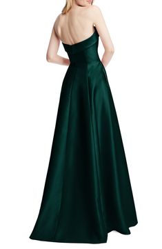 This strapless satin gown with a structured bodice and side-slant pockets features a twirl-ready full circle skirt. 54 1/2" length (size 8) Square neck Strapless Lined 100% polyester Dry clean or hand wash, line dry Imported