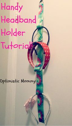 a handmade holder made out of ribbons and other items hanging on the wall with text overlay that reads, handy headband holder tutorial