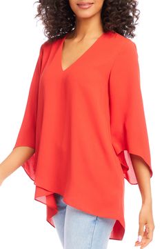 An elegant top of silky, lightweight crepe delivers elegant movement with its angled flare sleeves and fluttery asymmetrical hemline that dips low in back. 25 1/2" length (size Medium) V-neck Three-quarter sleeves Back yoke with gathering Crossover high/low hem 100% polyester Dry clean or hand wash, line dry Made in the USA of imported fabric Women's Clothing Flowy Blouse With Asymmetrical Hem For Spring, Flowy Spring Blouse With Asymmetrical Hem, Flowy Asymmetrical Hem Blouse For Spring, Spring Asymmetrical Silk Blouse, Chic Viscose Top With Asymmetrical Hem, Chic Viscose Tops With Asymmetrical Hem, Chic Flowy Blouse With Asymmetrical Hem, Asymmetrical Viscose Top For Spring, Evening Tops With Draped Sleeves For Summer