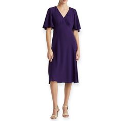 Make A Statement With This Stunning Lauren Ralph Lauren Dress, Featuring A Beautiful Purple Color In Size 2. The Dress Is Crafted With A Chiffon Fabric Type, Making It An Elegant And Comfortable Choice For Any Occasion. Its V-Neckline And Flutter Sleeves Add A Feminine Touch, While The Button Detail Closure Provides A Sleek And Sophisticated Look. This Midi-Length Dress Comes In A Fit & Flare, Shift, And A-Line Style, Ensuring A Flattering Fit For All Body Types. Whether You're Dressing Up For A Flutter Sleeve Midi Dress For Formal Occasions, Ralph Lauren Summer Midi Dress For Daywear, Ralph Lauren Midi Dress For Summer Daywear, Purple V-neck Midi Dress For Work, Elegant Ralph Lauren Dress With Ruffles, Fitted Midi Dress With Ruffle Sleeves For Daywear, Ralph Lauren Summer Dresses For Work, Summer Workwear Midi Dress With Flutter Sleeve, Formal Fitted Midi Dress With Flutter Sleeves