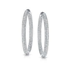 This delicate hoop earrings showcase 400 round-cut brilliant white natural diamonds in classic Pave setting. It is available in your choice of 14k white gold and secures with a Clip In clasp. These hoop earrings are a staple for every jewelry collection, and make the perfect gift for any occasion. Black Diamond Pendant, Black Diamond Studs, Halo Diamond Earrings, Solitaire Diamond Pendant, Colored Diamond Rings, White Lab, Halo Earrings, Black Diamond Ring, Diamond Drop Earrings