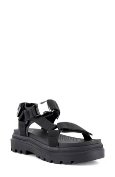 Enter the sunnier seasons in modern style with this platform sandal showcasing a sleek buckle strap and a grippy lugged sole for superior traction. 1 3/4" heel (size 7) Adjustable ankle strap with buckle and hook-and-loop closure Cushioned footbed Textile upper and lining/synthetic sole Imported Black Double Strap Platform Sport Sandals, Black Sport Sandals With Double Strap And Platform, Black Sport Sandals With Platform And Double Strap, Strapped Sandals With Buckle Closure For Vacation, Black Sport Sandals With Buckle Closure For Vacation, Summer Sport Sandals With Lug Sole And Round Toe, Black Platform Sport Sandals For Vacation, Black Footbed Sandals For Outdoor Summer, Black Summer Footbed Sandals For Outdoor