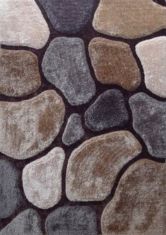 a close up of a rug with rocks on it in various colors and sizes,