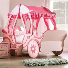 Fit for any princess, this contemporary wood carriage bed features a solid wood frame finished in a lovely light pink color with dark paint accents. With a functional headboard and footboard and a small stepping ladder for easy access to the youth bed, it's the perfect addition to any little girl's bedroom. About Furniture of America Furniture of America is proud to be the family friend that always has your back. Were more than just a business. Our customer care team is part of a larger FOA community dedicated to delivering a happy home. So browse our selection and invite warmth and character into every room in your home. Princess Carriage Bed, Carriage Bed, Fairytale Bedroom, Functional Headboard, Kids Canopy, Princess Carriage, Princess Bedroom, Pumpkin Carriage, Pink Curtains