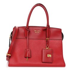 This is an authentic PRADA Saffiano City Calfskin Medium Esplanade in Rosso. This chic tote is crafted of stylish Saffiano cross-grain leather in red. The shoulder bag features rolled leather top handles, an optional shoulder strap, and polished gold hardware. The top zips open to a logo-jacquard fabric interior with zipper and patch pockets. Red Rectangular Epsom Leather Bag, Red Epsom Leather Rectangular Bag, Formal Red Epsom Leather Bag, Red Textured Leather Office Bag, Designer Red Calf Leather Bag, Elegant Red Saffiano Leather Shoulder Bag, Red Calf Leather Bag For Shopping, Red Calf Leather Shopping Bag, Red Saffiano Leather Top Handle Bag