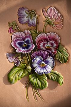 a painting of purple and pink flowers on a tan background with green leaves in the center