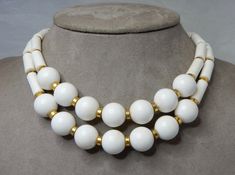 "Here's a nice quality choker necklace from MIMI di N, featuring two strands of white plastic beads; round in front and tkube shaped on the sides. It measures 14.1/2\" in length and has a decorative box clasp with Mimi di N's logo signature on the back. Nice clean and wearable condition. Thanks for looking." Brown Pearl Necklace, Large Bead Necklace, Bead Choker Necklace, Crescent Necklace, Rhinestone Choker Necklace, Bead Choker, Rhinestone Choker, Polymer Clay Necklace, Box Clasp