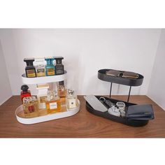 two trays with bottles and other items on them