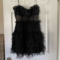 This Is Still Full Price On The Website! Black Color Is Sold Out & Hard To Find!! Now This Is True Love. Super Feminine Lace Mini Dress Featuring Flocked Dot Ruffled Tulle And A Sweetheart Neckline. Skirt Is Tutu-Style With Contrast Velvet Detailing And Adjustable Shoulder Straps. For Love & Lemons Runs Small As A Brand. So Size Large Is More Your Typical Medium. For Love & Lemons A-Line Dress Lace Flocked Dot Ruffle Tulle Flocked Dot Detail Sweetheart Neckline Tutu Skirt Contrast Velvet Taping Black Dress With Ruffles And Sweetheart Neckline, Black Sweetheart Neckline Dress With Ruffles, Black Strapless Mini Dress With Ruffles, Black Mini Dress With Ruffled Straps For Party, Black Mini Dress With Sweetheart Neckline And Ruffles, Black Strapless Dress With Ruffle Hem, Black Dress With Sweetheart Neckline And Ruffle Hem, Black Dress With Ruffled Straps For Night Out, Black Tiered Mini Dress For Evening