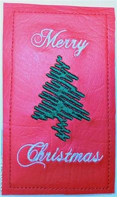 a red christmas card with a green tree on it