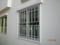 a window with bars on the outside of it