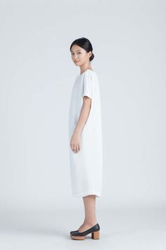 Minimalist Fitted Midi Dress, Elegant Longline Summer Dresses, Elegant Longline Midi Dress For Summer, Summer Work Dresses With Side Slits, Summer Workwear Dresses With Side Slits, Minimalist Fitted Spring Dresses, Fitted Minimalist Spring Dress, Structured Summer Evening Dress, Knee-length Midi Dress With Side Slits For Daywear