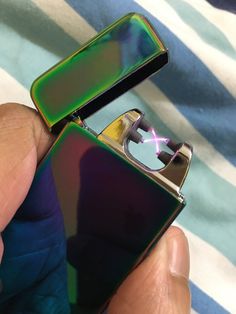 an advertisement for a lighter that is green and blue with the words plasma light up to 100 lights per charge