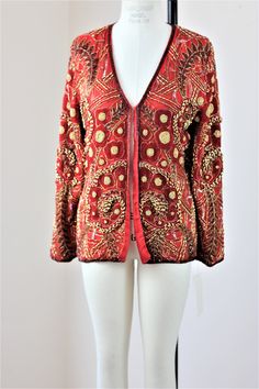 "Stunning ...heavily beaded..with gold and beads throughout...this is soo heavy and oh so beautiful!! Excellent for anytime of year. Are you a red person? This is a great jacket to put against a black dress..or simple outfit..to dress it up and make it formal!! Excellent condition! Measuring: 25\" length Width: 40\" Sleeves: 23\" Pet Free/smoke free Enjoy!" Winter Party Outerwear With Gold Embroidery, Festive Party Outerwear With Gold Embroidery, Fitted Party Outerwear With Gold Embroidery, Gold Cardigan For Winter Party, Fitted Red Outerwear For Festival, Bohemian Fitted Cardigan For Party, Festive Long Sleeve Sequin Outerwear, Glamorous Embellished Outerwear For Festive Occasions, Embellished Long Sleeve Cardigan For Party