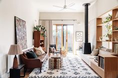 a living room filled with furniture and a fire place