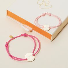 Moments and memories for mom, our Merci Maman x Mellipou Personalized Mother &amp; Child Bracelet Set captures the love of mom and child with a matching bracelet for both to treasure. Each bracelet features an engraved Mellipou logo and can be hand-engraved with the names of mum and little one, or a word that connotes their everlasting love.&nbsp;18K Champagne Gold Plated or 925 Sterling SilverPastille charm: 0.6x0.6Mini Pastille Charm: 0.4x04Mother bracelet Size: 7-8Choose from a wide r Adjustable Jubilee Bracelet For Mother's Day, Mother's Day Friendship Jubilee Bracelet, Pink Bracelets For Valentine's Day Gift For Mom, Pink Bracelets For Mom For Valentine's Day, Pink Bracelets For Mom On Valentine's Day, Pink Bracelets For Mom, Valentine's Day Gift, Pink Bracelet For Mom, Valentine's Day Gift, Adjustable Heart Bracelet Gift, Pink Adjustable Bracelet As A Gift For Mom