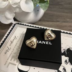 Gorgeous Chanel Cc Pearly White Heart Stud Earrings 100% Authentic 2023 Collection By Virginie Viard Made In Italy Gold Tone Metal Excellent Condition. Never Worn Aside From Trying On Initially. Comes With Box Chanel Stud Earrings, Earrings Chanel, Chanel Jewelry Earrings, Chanel 2023, Cc Earrings, Jewelry Chanel, Chanel Earrings, Crystal Hoop Earrings, Circle Earrings Studs