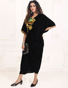 Velvet Onyx Black Designer Bohemian Stylish Kaftan sleeveless with a V Shape neck easy to wear for all age of women Dress belongs to the digital print work with little multi color embroidery at the front and sleeves Hijab and band shown in the image can be bought separately Fabric: VelvetCare: Mild machine wash/ hand Cold Wash/ Dry cleanWe request customers to carefully choose the correct size and dress length referring to our size chart Black Kaftan For Eid, Black Bohemian Kaftan For Party, Black V-neck Kaftan For Festive Occasions, Black Bohemian Party Kaftan, Bohemian Black Party Kaftan, Traditional Black Free Size Kaftan, Black Bohemian Kaftan For Eid, Bohemian Black Kaftan For Eid, Festive Black Tunic Kaftan