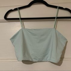 Never Worn; New Without Tags Fits Like A Bralette/ Bandeau Spring Light Blue Tank Top With Built-in Bra, Light Blue Tank Top With Built-in Bra For Spring, Blue Cotton Cami Crop Top, Light Blue Spring Tops With Built-in Bra, Light Blue Tops With Built-in Bra For Spring, Light Blue Cami Crop Top For Spring, Light Blue Fitted Cotton Crop Top, Blue Cotton Top With Built-in Bra, Light Blue Workout Top For Spring