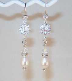 Classy! Thats all you can say about these earrings. Sparkling Swarovski crystal flowers, beautiful white Swarovski teardrop pearls, lovely silver and crystal rondelles topped by a pretty Swarovski crystal bicone all suspended on sterling silver earwires with 4mm cubic zirconias. The earrings come in Fancy Earrings Classy, Crystal Flowers, Crystal Bridal Earrings, Vintage Jewelry Crafts, Bride Earrings, Flowers Beautiful, Gold Fashion Necklace, Homemade Jewelry, Wedding Jewelry Earrings