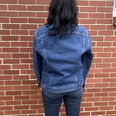 "This denim jacket is made in the USA, with quality you can rarely find. Lined with a warm wool in gray striped pattern and the jacket is in great condition. Plenty of pockets and beautiful metal buttons complete this size 42 vintage jean jacket. 100% cotton denim. Jacket is men's sizing but is a unisex design. -Model size women's medium/large. -Model size men's large. Approximate measurement when laid flat: 24\" armpit to armpit 19\" shoulder to shoulder 25\" sleeve 25\" back of collar to hem" Winter Dark Wash Single Breasted Denim Jacket, Winter Dark Wash Single-breasted Denim Jacket, Winter Single Breasted Dark Wash Denim Jacket, Winter Single-breasted Dark Wash Denim Jacket, Winter Outerwear With Flap Pockets In Medium Wash, Classic Medium Wash Outerwear With Patch Pockets, Classic Medium Wash Outerwear With Flap Pockets, Classic Dark Wash Outerwear With Patch Pockets, Winter Denim Outerwear With Double-needle Sleeve