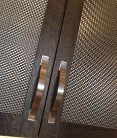 a close up of two doors with metal handles