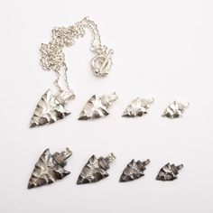 Top offer of the season! Silver Arrowhead Pendant | Native American Inspired | Arrow Charm | Hammered Silver Pendant | Rustic Silver Charm | Oxidized Silver Jewelry, now at an exclusive price of $59.00
#RusticSilverCharm #OxidizedSilver #IndianArrowhead #SilverArrowhead #ArrowCharm #ArrowPendant #NativeAmerican #925SterlingSilver #HammeredSilver #ArrowheadPendant Arrowheads Jewelry, Arrowhead Pendant, Native American Traditions, Oxidised Silver Jewelry, Arrowhead Necklace, Hammered Silver, Silver Pendants, Custom Bracelets