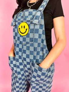 Rock your style with Life is a Mixtape Checkered Overalls! Made of denim with a playful checkered pattern, these overalls will bring a smile to your face. Perfect for a fun, casual summer look, they're easy to wear and perfect for cool girls who don't take themselves too seriously. -So unique and so fun! -Relaxed, loose fit! -Puffy style smiley face on the front pocket! -Amazing quality! -All over denim and acid wash checkered pattern -- OBSESSED! -Oversized chest and side pockets -Slightly crop Trendy Cotton Shortalls, Trendy Blue Cotton Shortalls, Checkered Overalls, Kimono Coat, Checker Print, Summer Look, Checkered Pattern, Acid Wash, Smiley Face