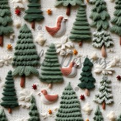 some christmas trees and birds on a table