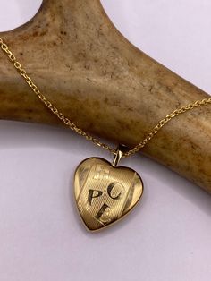 Vintage tiny mini heart locket  9k Gold filled Engraved with Hope for world peace  This tiny treasure has about a half inch photo space, just the locket without the bale.  Vintage 1960's one of a kind.  Does not tarnish or change color.  on a gold 925 chain 16, 18, 20 or 24 inch  Lovely etched design Can hold tiny sized photo. Laminate photo before inserting for longevity  Ships on a gold 925 sterling silver chain  Thank you for supporting a small veteran owned business! All jewelry is shipped f Vintage Gold Locket, Gold Locket, Sterling Silver Chain Necklace, Photo Locket, Tiny Treasures, Mini Heart, 925 Sterling Silver Chain, Heart Locket, Engraved Necklace