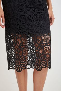 Reach for our Crochet Lace Midi Skirt for a sophisticated, fresh Fall look. The beautiful, scalloped hem is accented by the shorter lining for a glimpse of leg. Dress it down with a vegan leather jacket or cashmere or up with Satin. Limited Edition 50th Anniversary Collection Elie Tahari Exclusive Crochet Lace Midi Skirt 100% Polyester Runs true to Size Length From Waist to Hem: Back 30.25"L (approx. length for size 6) Model is 5'9" and wearing size 2 Dry Clean Only Imported Style #: E905R304 Lace Midi Skirt, Tahari Dress, Vegan Leather Jacket, Long Sleeve Short Dress, Black Midi Skirt, Elie Tahari, Lace Midi, Knit Tees, Scalloped Hem