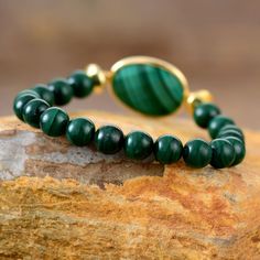 This gorgeous malachite bracelet is a luxurious addition to your wardrobe! Sparkling malachite pairs perfectly with everyday outfits, for a subtle touch of flair that screams "fabulous!" Spice up any ensemble with this dazzling bracelet - you won't regret it! Material: A bracelet made with 8mm 100% new and high-Quality beads. Beads' material from malachite. Making Technics: Full Handmade, our beaded bracelets are individually made using hand-selected semi-precious gemstone beads. All gemstones a Malachite Bracelet, Yoga Jewelry, Spice Up, Semi Precious Gemstones, Womens Bracelets, Bracelet Making, Everyday Outfits, Spice Things Up, Gemstone Beads