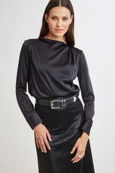 Chic & edgy, the draped neck of our luxe Silk Satin shirt creates a cool modern vibe that feels as good as it looks. The luxe patina, relaxed fit & soft neckline lend a feminine vibe to this must-have silk shirt. Elie Tahari Exclusive Long Sleeve Draped Neck Silk Shirt 93% Silk, 7% Elastane Runs true to Size Length From Shoulder to Hem: Back 23.25"L, Sleeve: 32.5"L (approx. length for size S) Model is 5'9" and wearing size XS Dry Clean Only Imported Style #: E9053534 Tahari Dress, Long Sleeve Short Dress, Satin Shirt, Elie Tahari, Modern Vibe, Knit Tees, Denim Coat, Knit Jacket, Silk Shirt